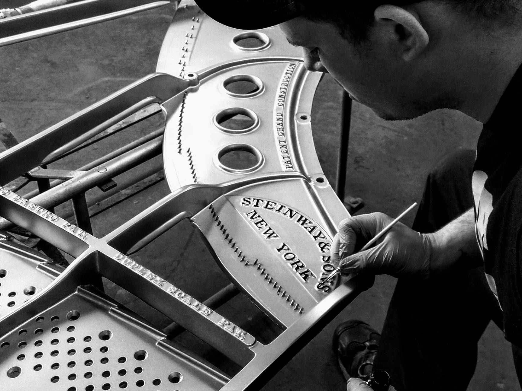 Employee completing Piano restoration at Gist