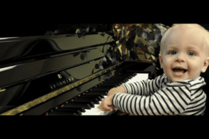 Toddler boy playing the piano